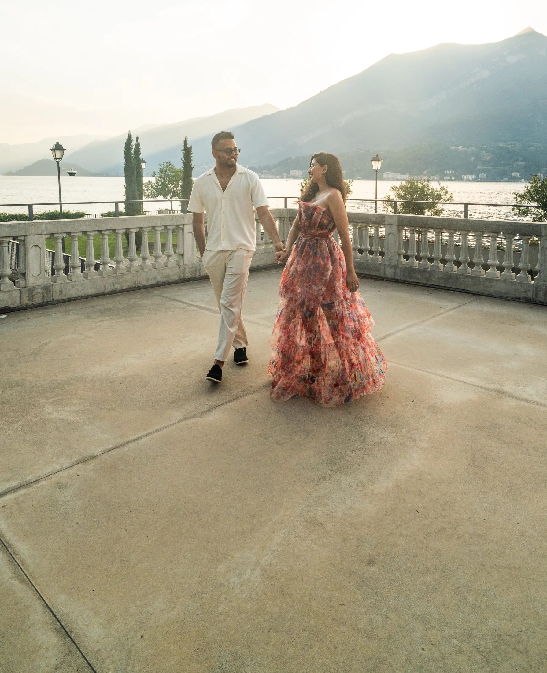 Shefali and Rajiv on a lakeside terrace in Lake Como